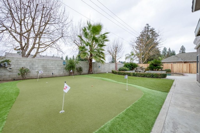 view of community featuring a fenced backyard