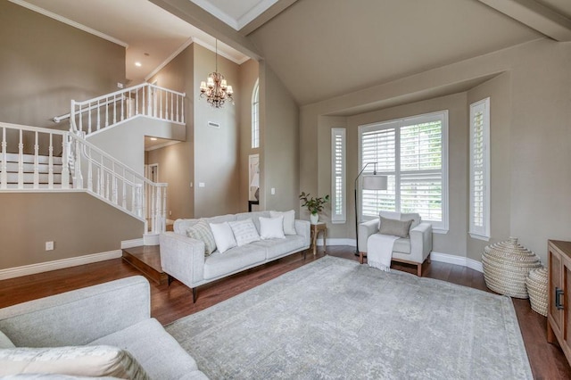 living area with a chandelier, stairway, wood finished floors, and baseboards