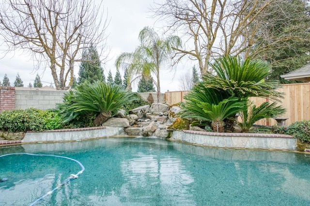 view of pool featuring a fenced backyard and a fenced in pool