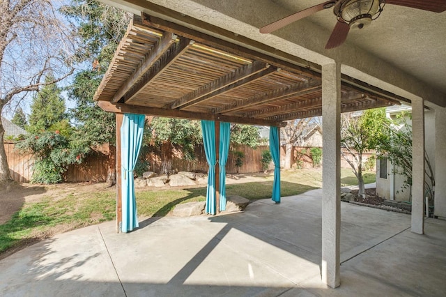 view of patio featuring a fenced backyard, a pergola, and a ceiling fan