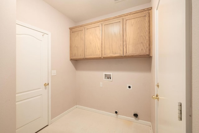 clothes washing area featuring washer hookup, cabinet space, electric dryer hookup, and baseboards