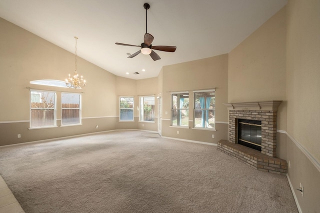 unfurnished living room featuring ceiling fan with notable chandelier, high vaulted ceiling, carpet floors, and a fireplace