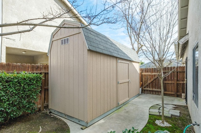 view of shed with fence