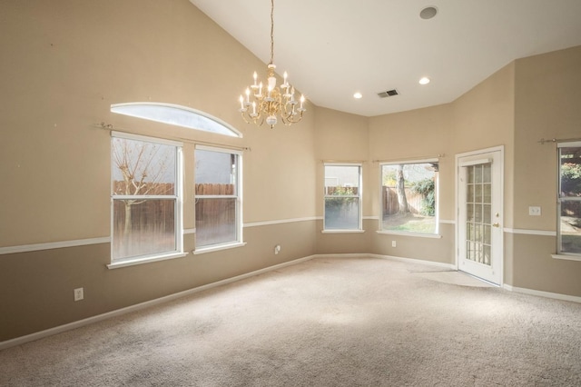 carpeted empty room with high vaulted ceiling, baseboards, visible vents, and recessed lighting