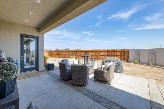 6375 E Millie Dr, Fresno, CA 93727 - fenced backyard with an outdoor living space, a patio area, and area for grilling