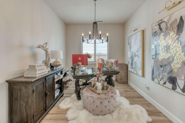 6375 E Millie Dr, Fresno, CA 93727 - dining room with a chandelier, light wood-style floors, and baseboards