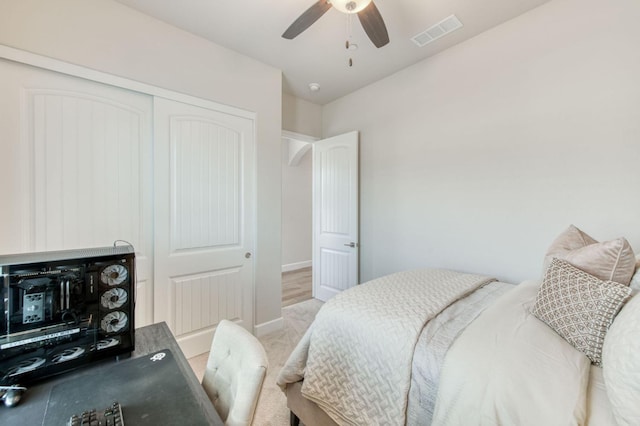 6375 E Millie Dr, Fresno, CA 93727 - bedroom with a closet, light colored carpet, ceiling fan, and baseboards
