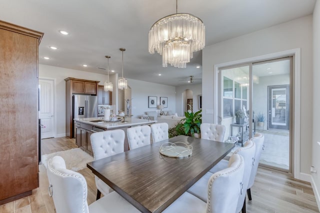6375 E Millie Dr, Fresno, CA 93727 - dining space with recessed lighting, light wood-style flooring, a chandelier, and baseboards