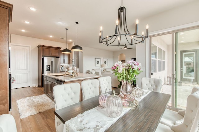 dining area featuring light wood-style flooring and recessed lighting