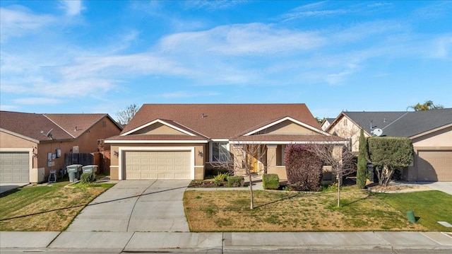 view of front of home featuring a garage, a front yard, driveway, and stucco siding