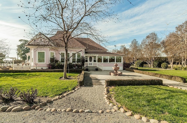 exterior space featuring crawl space, fence, concrete driveway, and a yard