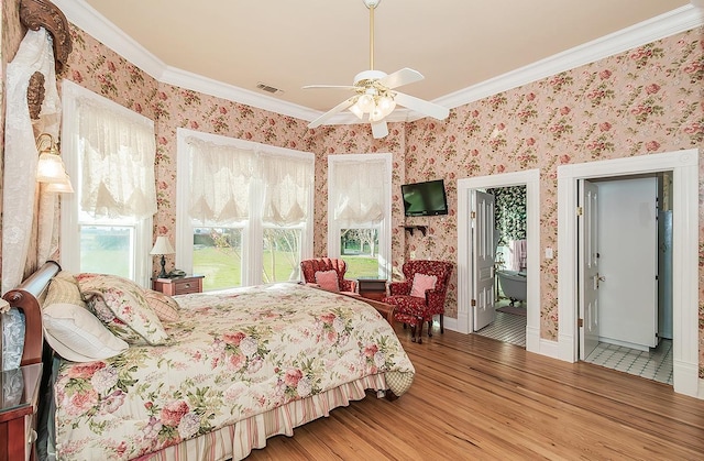 bedroom featuring wallpapered walls, visible vents, crown molding, and wood finished floors