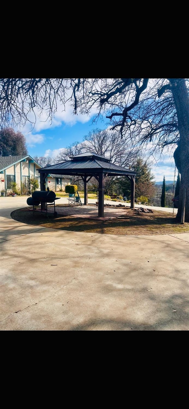 view of home's community with a carport and concrete driveway