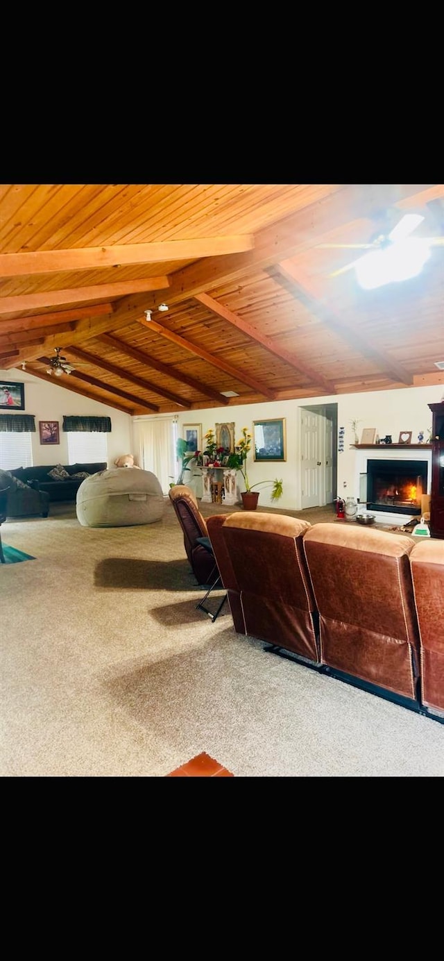 carpeted living room with lofted ceiling, a fireplace, and wood ceiling