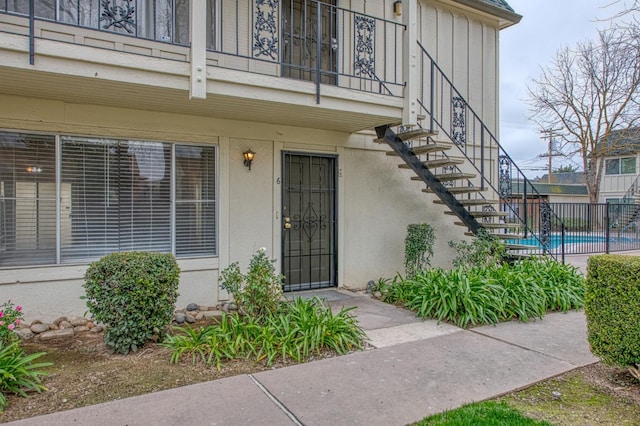 view of exterior entry with stucco siding