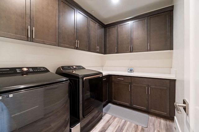 1048 Sawtooth Way S, Madera, CA 93636 - laundry area featuring cabinet space, washer and clothes dryer, and light wood-style flooring