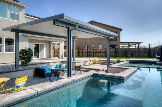 view of swimming pool featuring a patio area, fence, an outdoor hangout area, and a fenced in pool