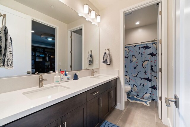1048 Sawtooth Way S, Madera, CA 93636 - bathroom with toilet, double vanity, a shower with curtain, and recessed lighting