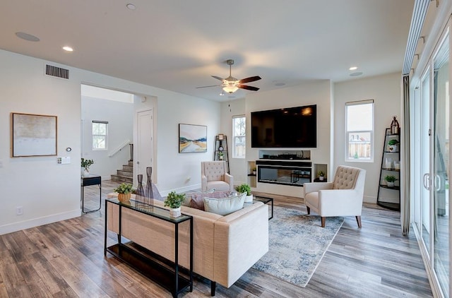 1048 Sawtooth Way S, Madera, CA 93636 - living area with stairs, wood finished floors, a ceiling fan, baseboards, and recessed lighting