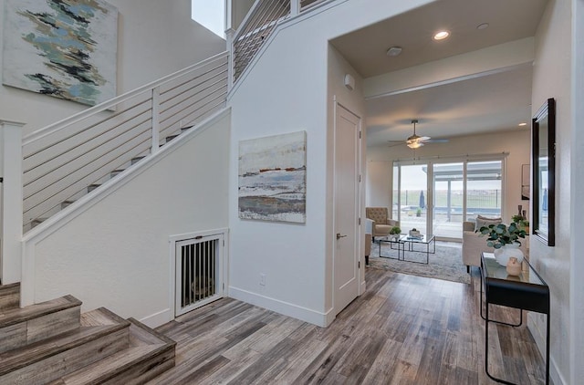 1048 Sawtooth Way S, Madera, CA 93636 - foyer entrance with wood finished floors, a ceiling fan, stairs, baseboards, and recessed lighting