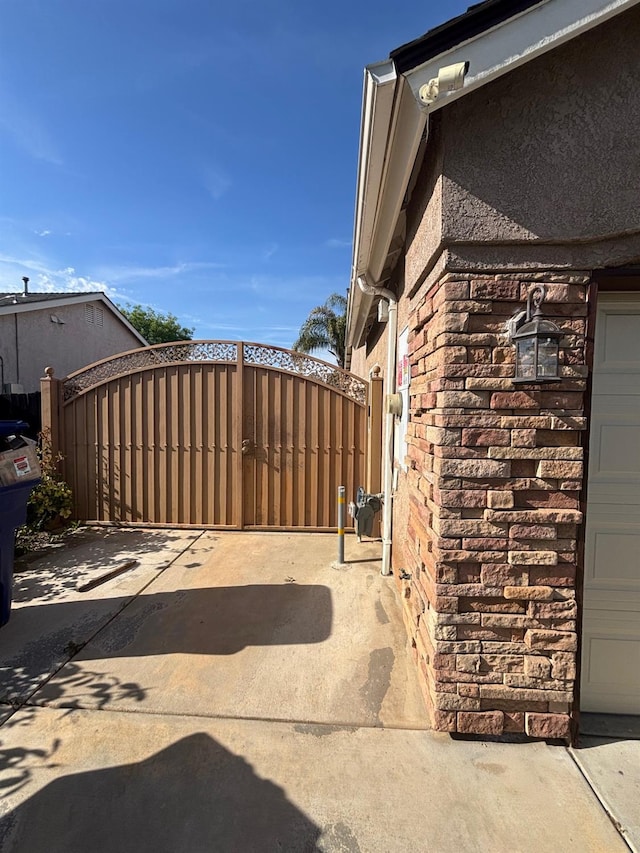 2136 Florence Ave, Sanger, CA 93657 - exterior space with stone siding, a gate, and stucco siding