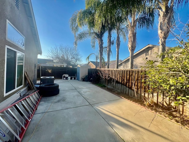 view of patio featuring central AC and a fenced backyard