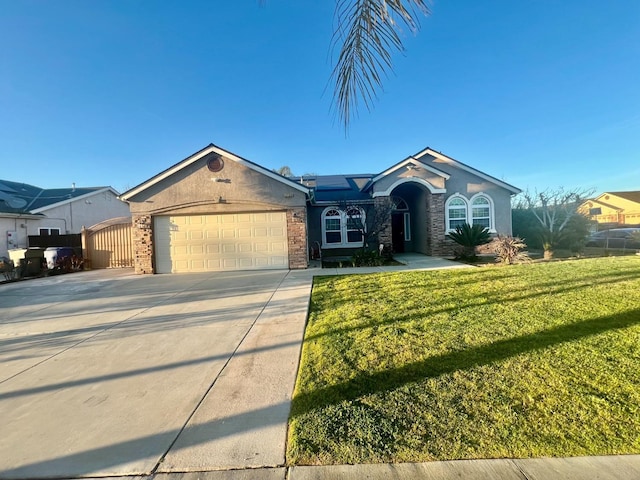 single story home with driveway, stucco siding, an attached garage, a front yard, and brick siding