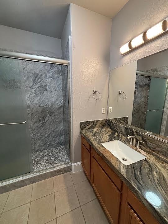 2136 Florence Ave, Sanger, CA 93657 - bathroom featuring a shower stall, vanity, and tile patterned flooring