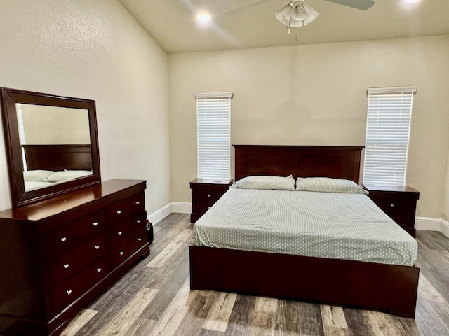 bedroom featuring light wood-style floors, ceiling fan, and baseboards