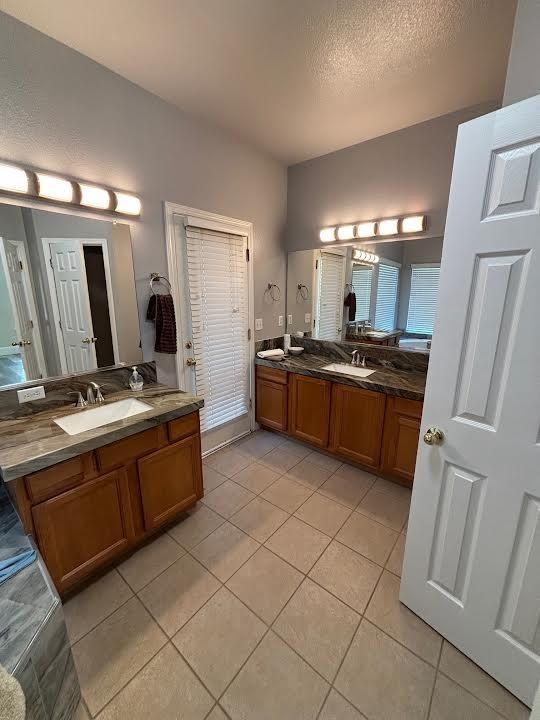 2136 Florence Ave, Sanger, CA 93657 - full bathroom with tile patterned flooring, a sink, and two vanities