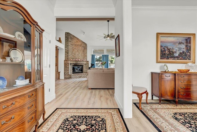 interior space with light wood-style floors and crown molding