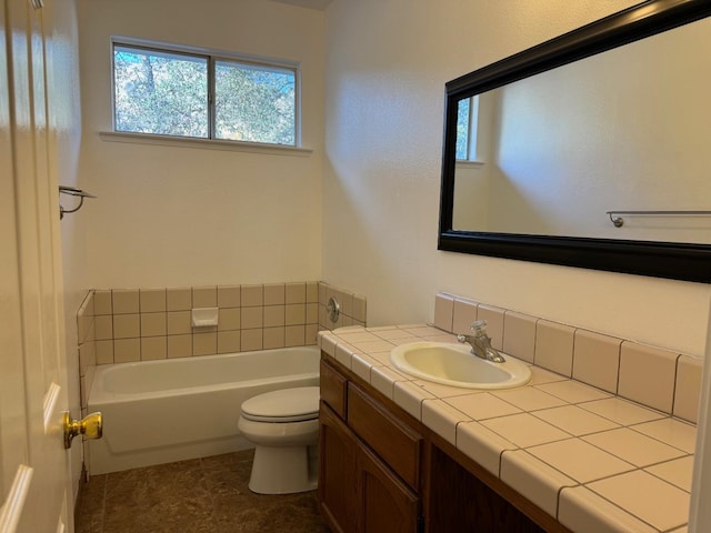 full bath featuring toilet, a garden tub, and vanity