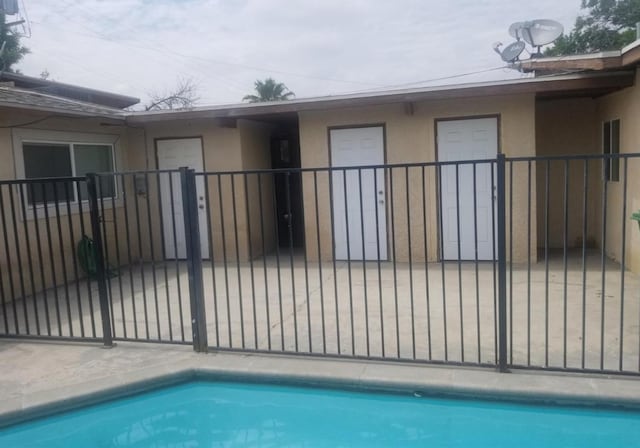 view of pool with a fenced in pool, a gate, and fence