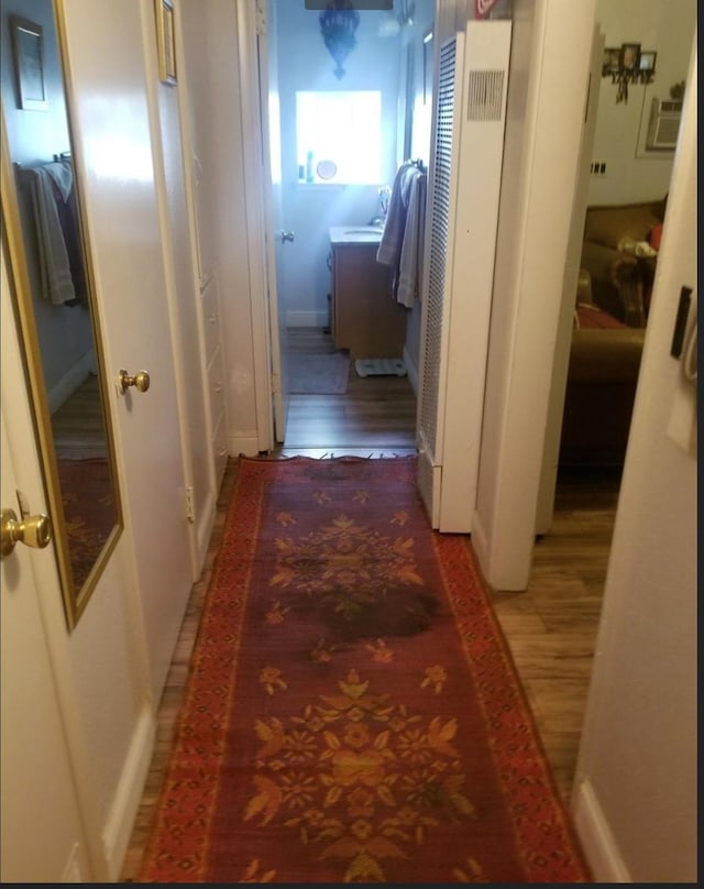 hall featuring wood finished floors