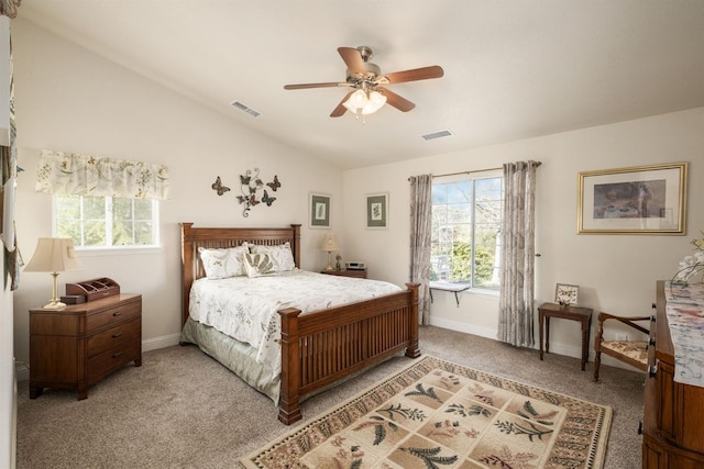 bedroom featuring visible vents, lofted ceiling, light colored carpet, and baseboards