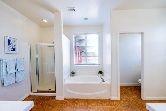 full bath with a stall shower, tile patterned floors, visible vents, and a bath