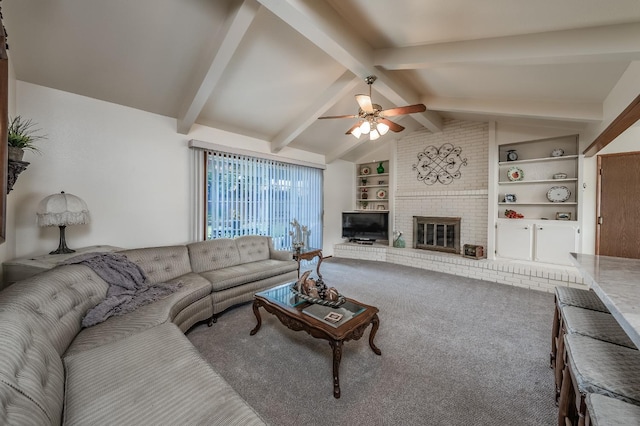 living area featuring lofted ceiling with beams, built in shelves, a fireplace, carpet flooring, and a ceiling fan