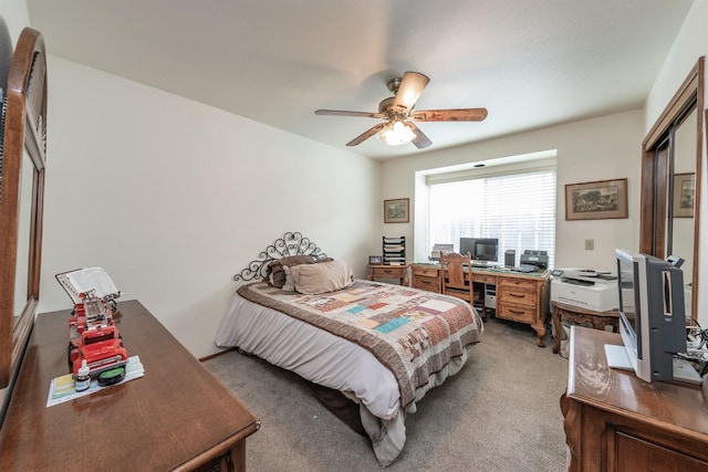 bedroom with ceiling fan and carpet floors