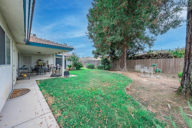 view of yard with a patio and a fenced backyard