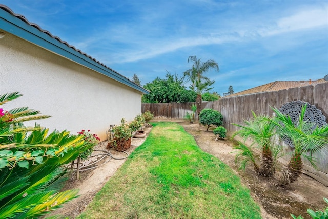 view of yard with a fenced backyard