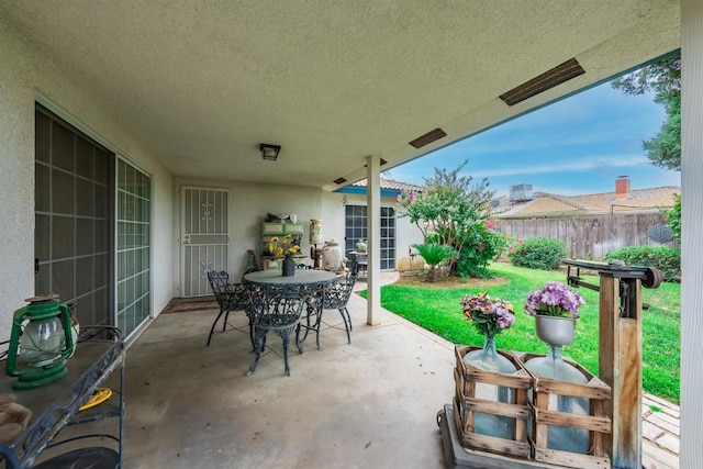 view of patio / terrace featuring outdoor dining space and fence