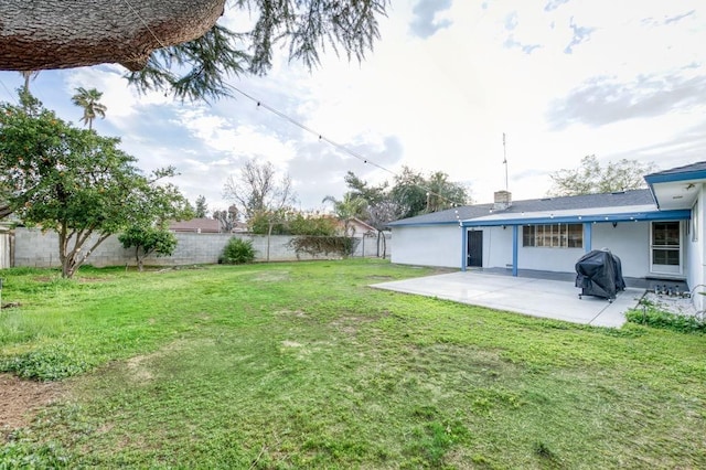 view of yard featuring a patio and a fenced backyard