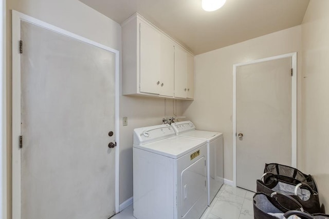 laundry area with marble finish floor, baseboards, cabinet space, and independent washer and dryer