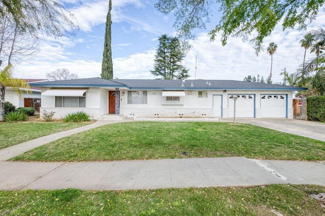 ranch-style house featuring an attached garage, driveway, a front yard, and stucco siding