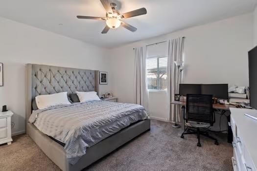 bedroom featuring a ceiling fan and light colored carpet