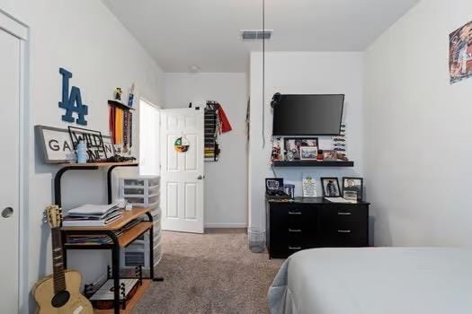 bedroom featuring carpet floors and visible vents