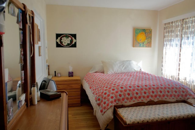 bedroom featuring light wood-style flooring