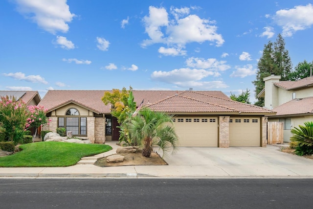 view of front facade featuring an attached garage, brick siding, driveway, and a tiled roof