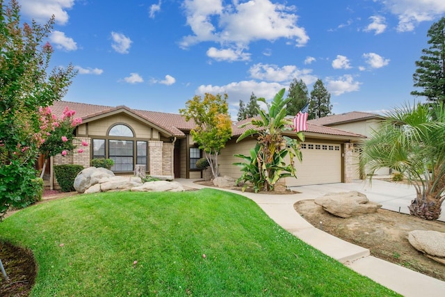 view of front of property with a garage, concrete driveway, brick siding, and a front yard