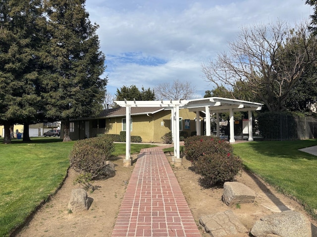 exterior space with fence and a pergola